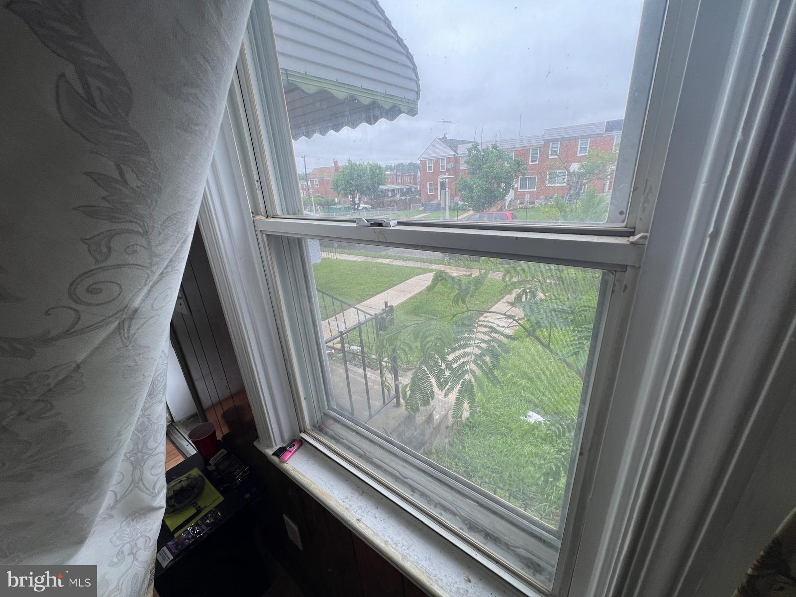 3917 Dudley Avenue Baltimore, MD 21213 - Photo 18 of 65 a view of backyard from window