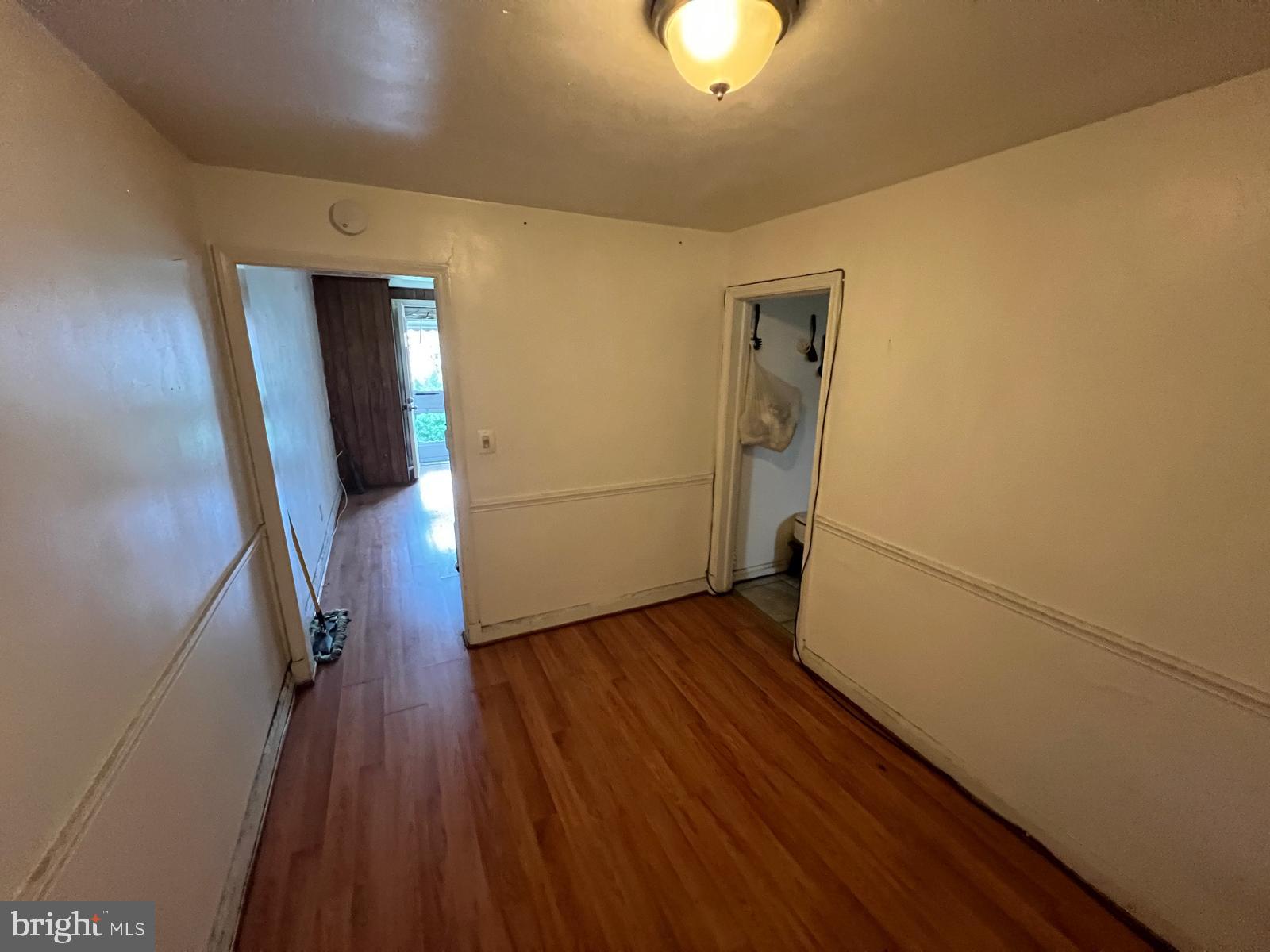 3917 Dudley Avenue Baltimore, MD 21213 - Photo 25 of 65 a view of a hallway with wooden floor