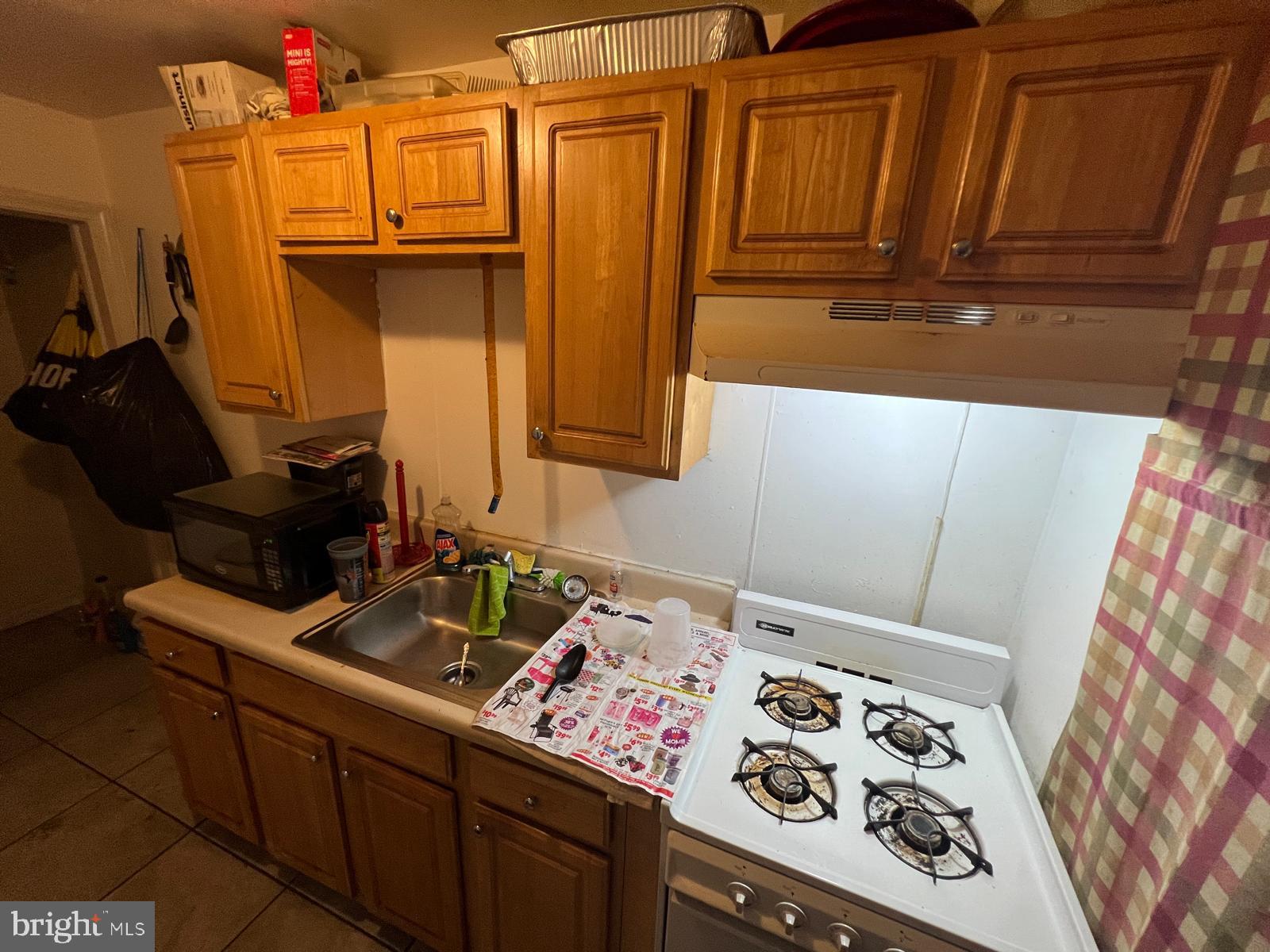 3917 Dudley Avenue Baltimore, MD 21213 - Photo 30 of 65 a bathroom with a sink and a mirror