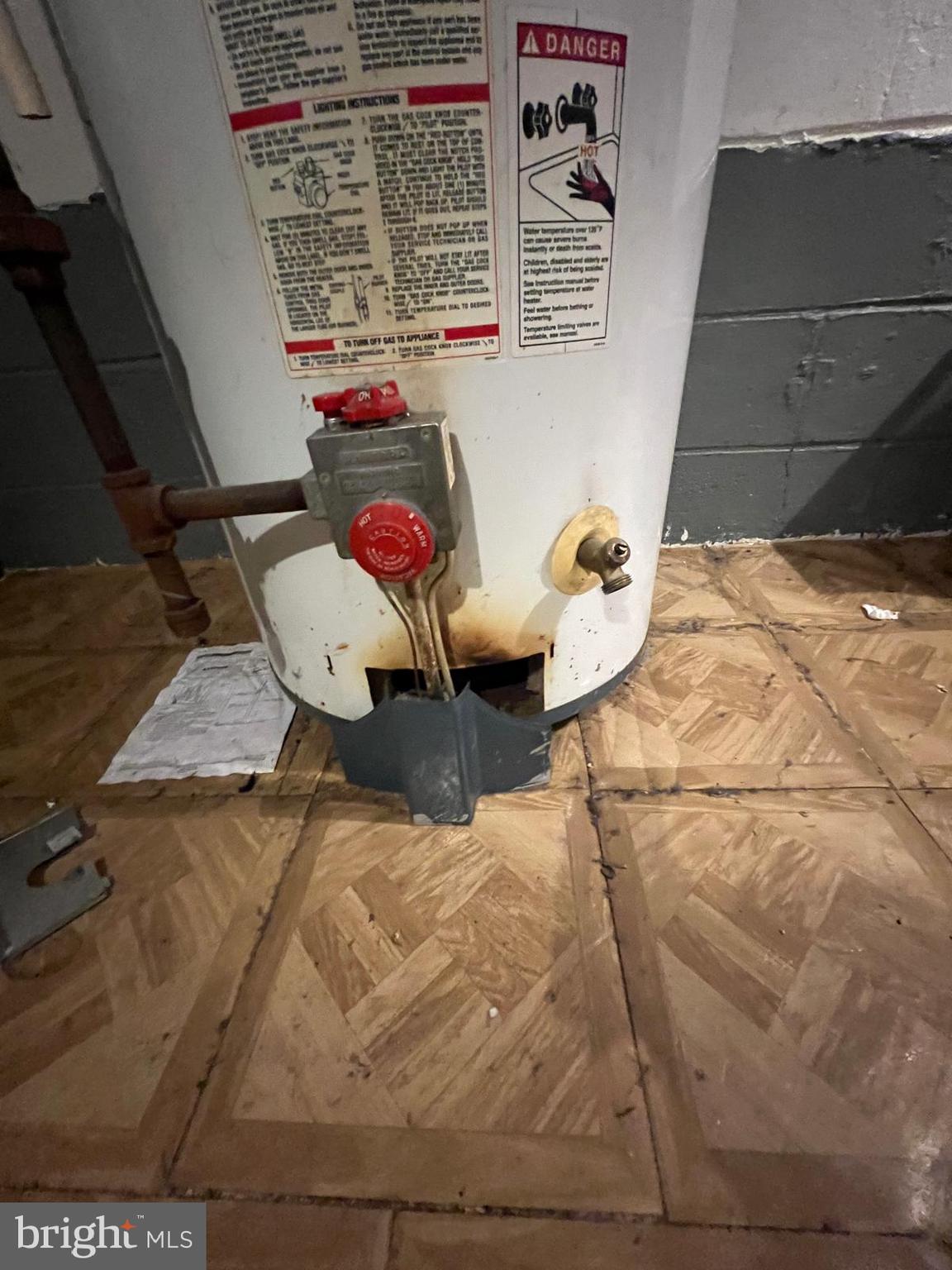 3917 Dudley Avenue Baltimore, MD 21213 - Photo 46 of 65 a picture of water heater room