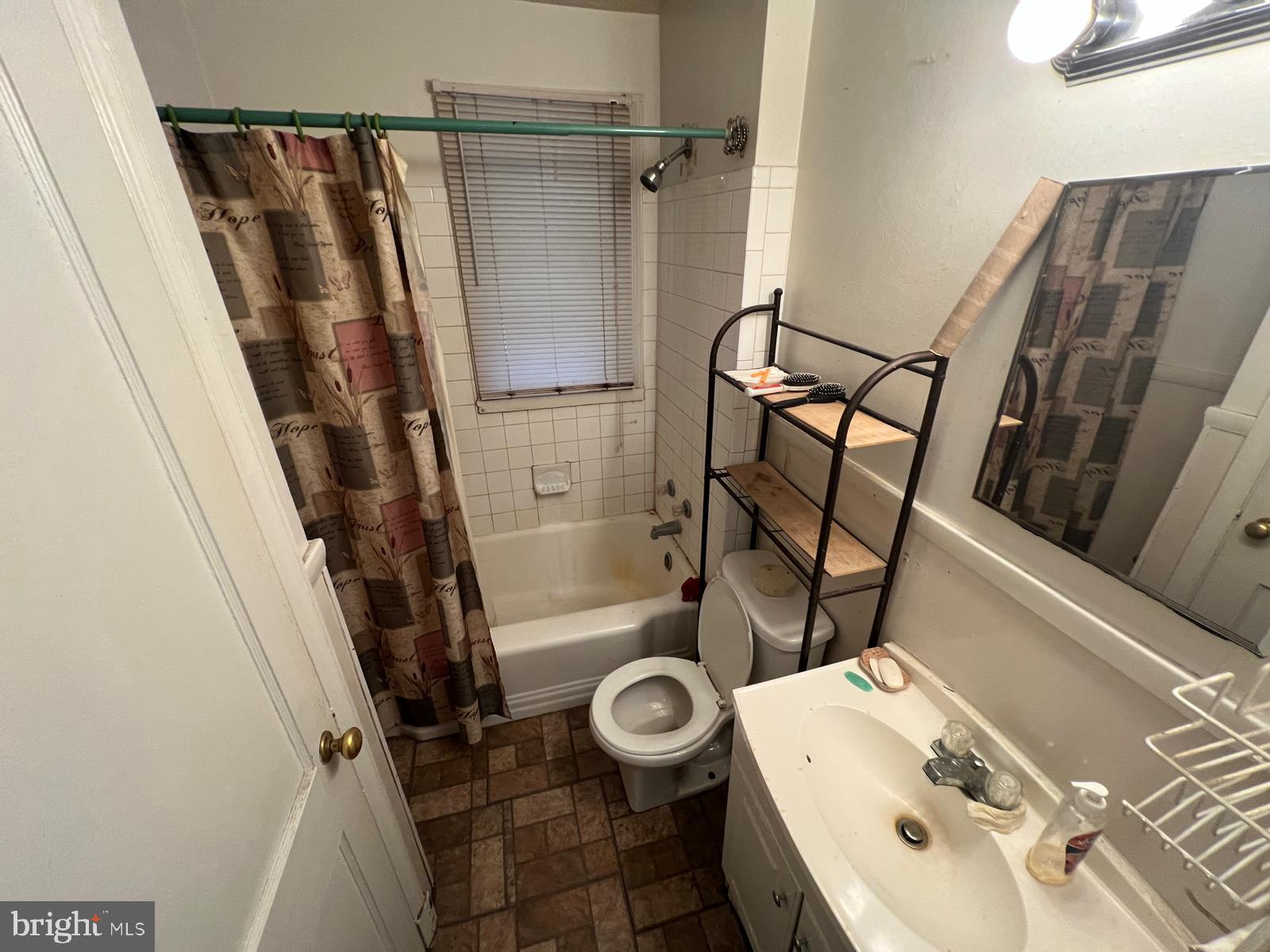 3917 Dudley Avenue Baltimore, MD 21213 - Photo 61 of 65 a bathroom with a sink toilet and shower