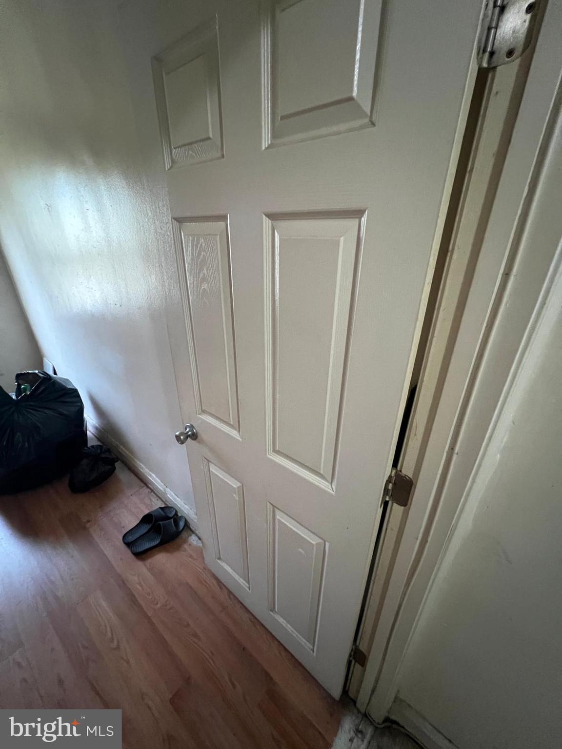 3917 Dudley Avenue Baltimore, MD 21213 - Photo 8 of 65 a room with wooden floor and stairs