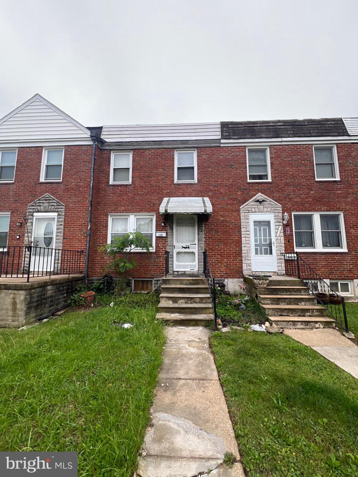3917 Dudley Avenue Baltimore, MD 21213 - Photo 10 of 65 a front view of a house with garden