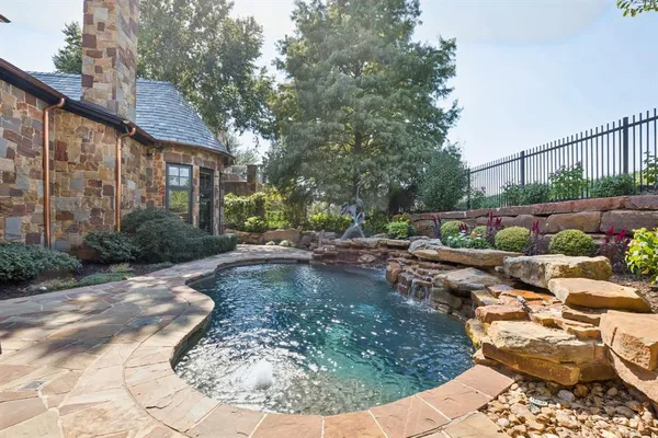 a outdoor living space with patio furniture and a fireplace