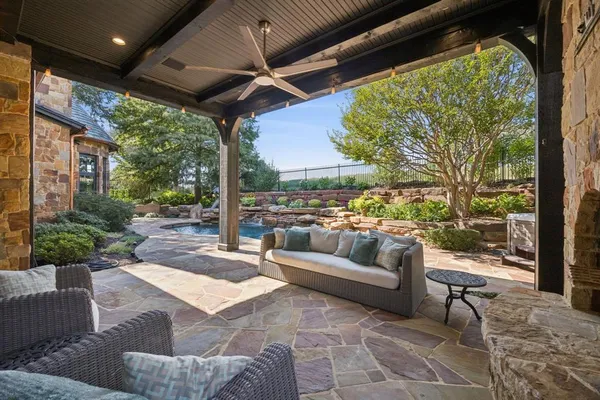 a view of a swimming pool with a patio