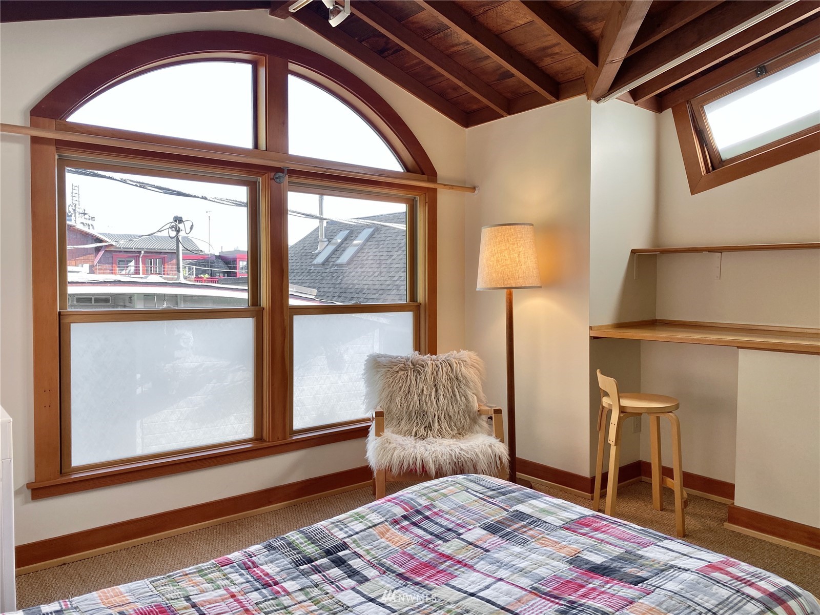 2019 Fairview Avenue East, Unit R Seattle, WA 98102 - Photo 11 of 23 a bedroom with a bed and a window