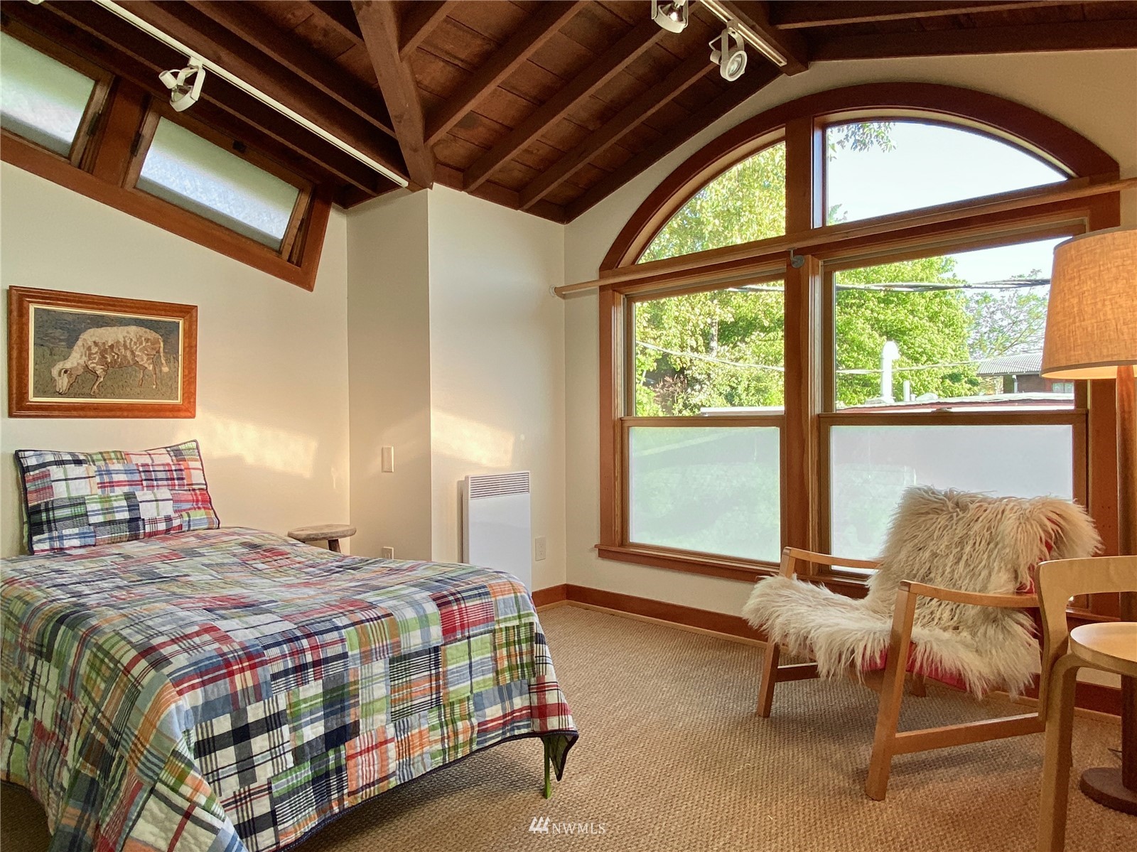 2019 Fairview Avenue East, Unit R Seattle, WA 98102 - Photo 12 of 23 a bedroom with a bed and a large window