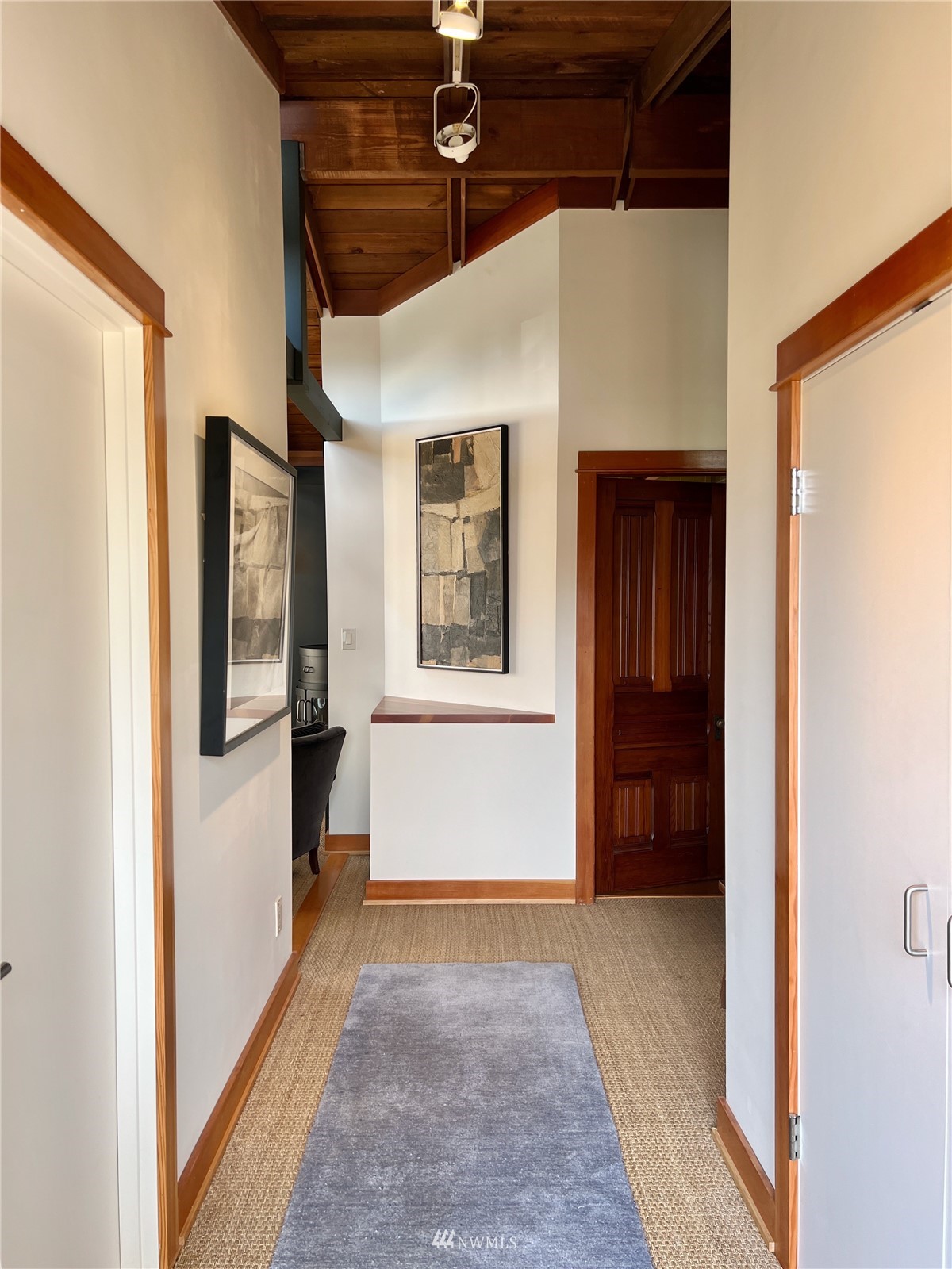 2019 Fairview Avenue East, Unit R Seattle, WA 98102 - Photo 5 of 23 a view of a hallway with wooden floor and staircase