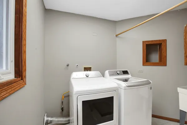 a utility room with dryer and washer