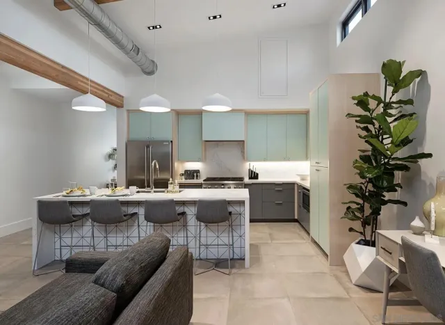 a living room with furniture and a potted plant