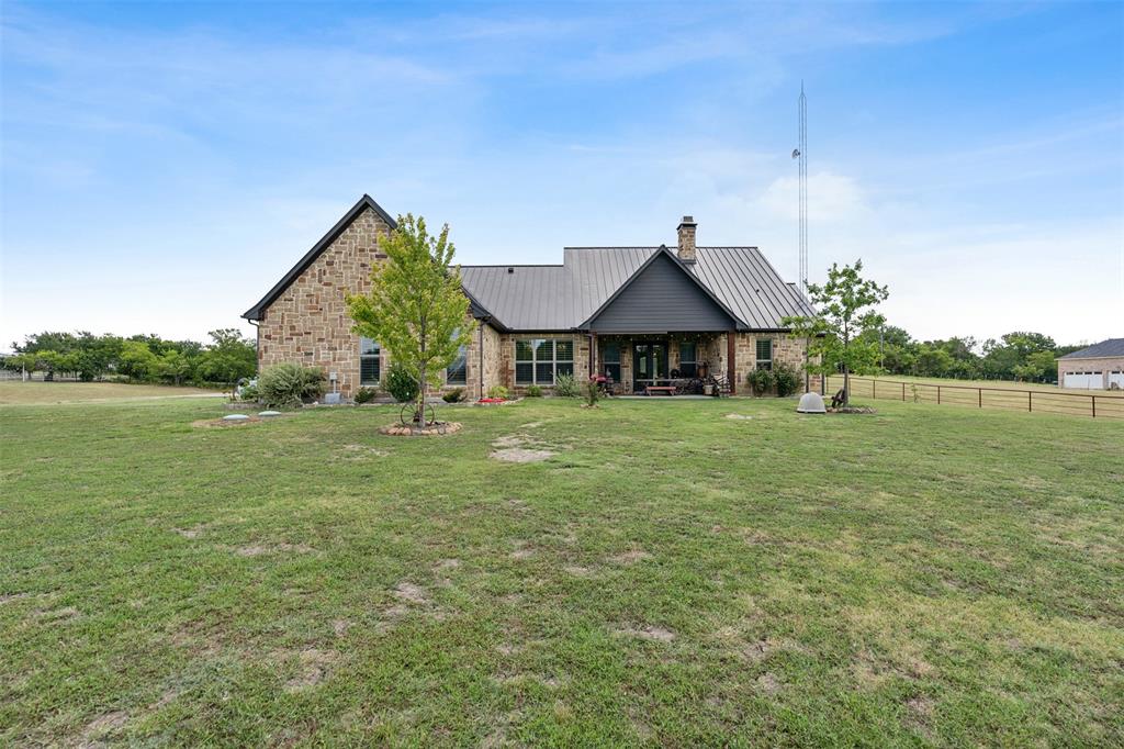 4180 North Smith Road Fate, TX 75087 - Photo 26 of 27 a backyard of a house with lots of green space