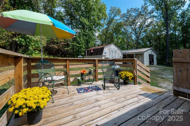 a view of a chair and tables on the roof deck