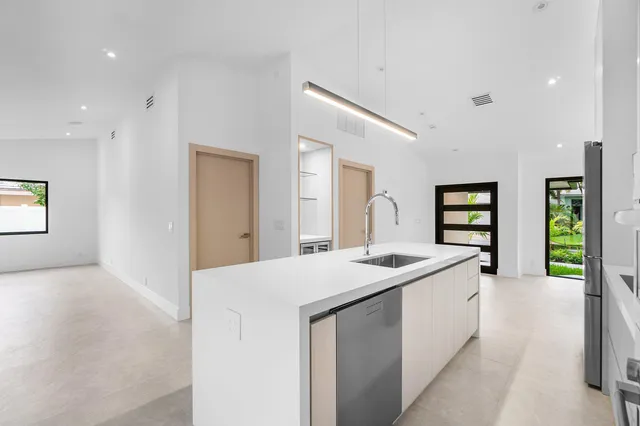 an empty room with a empty space and windows