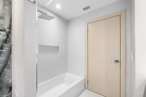 an empty room with large windows