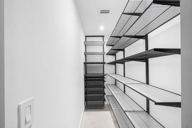 a view of a house with swimming pool and sitting area