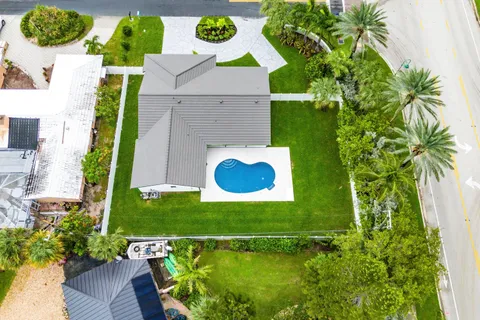 an aerial view of residential houses with outdoor space