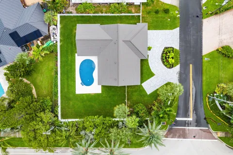 an aerial view of residential houses with outdoor space