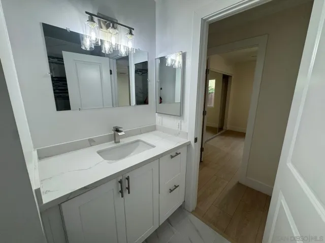 a bathroom with a sink and a mirror