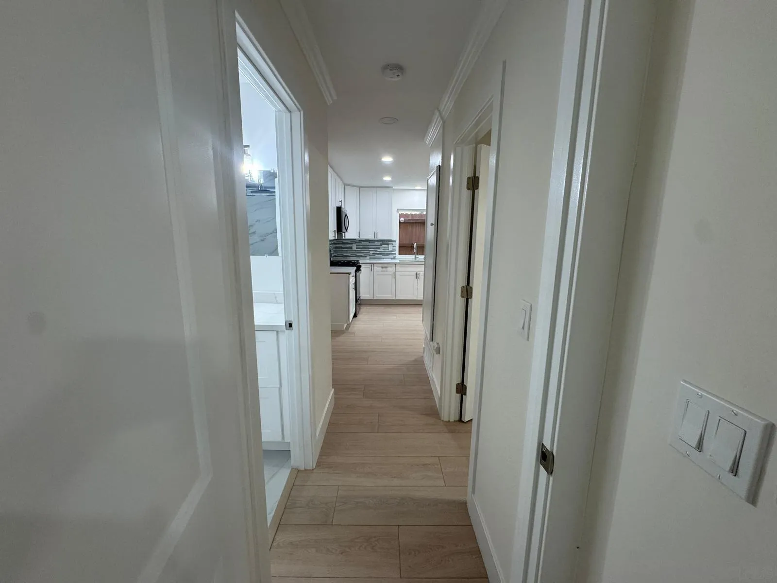 1205 27th Street San Diego, CA 92154 - Photo 15 of 25 a view of a hallway with a view of living room