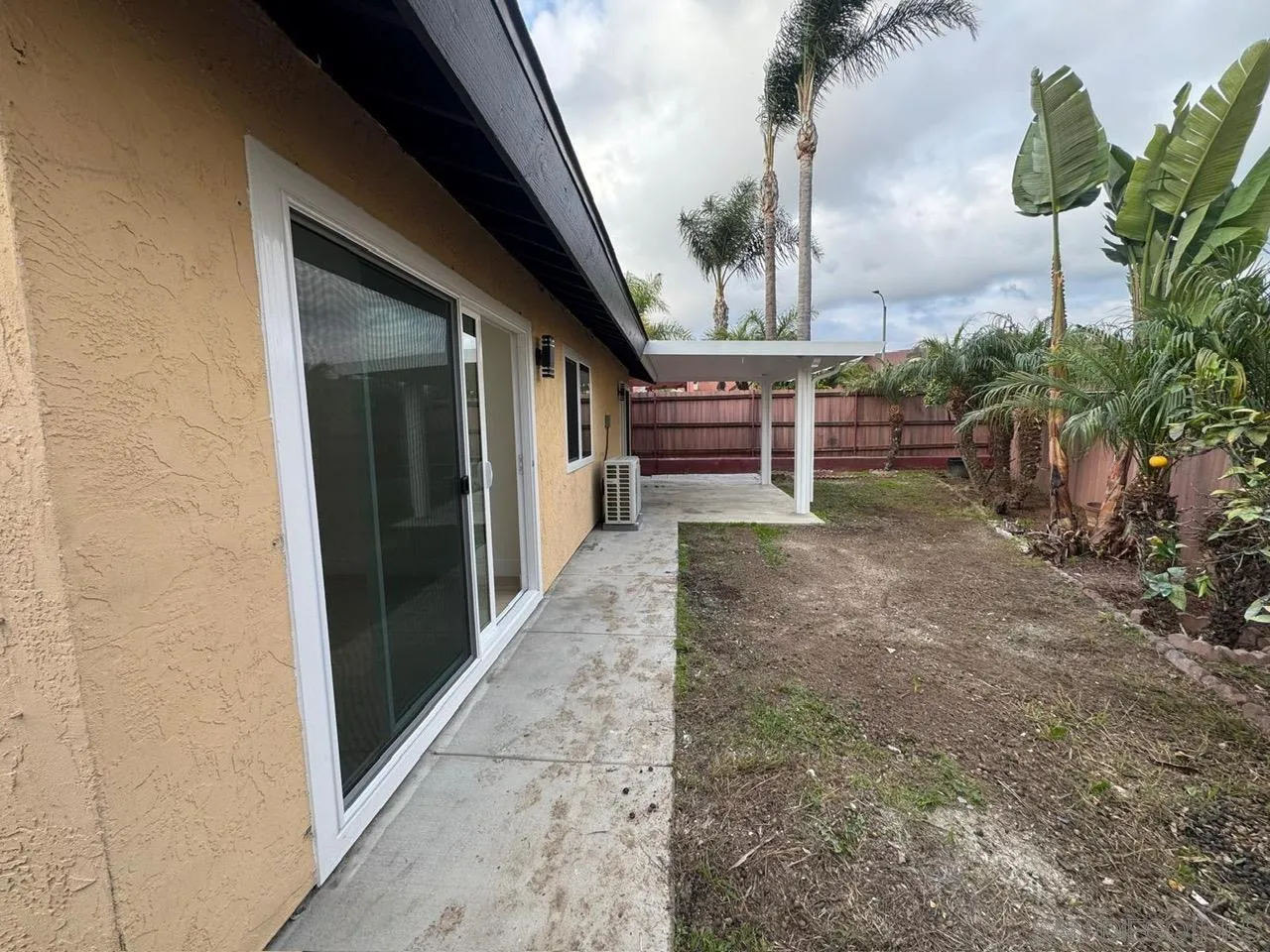 1205 27th Street San Diego, CA 92154 - Photo 23 of 25 a view of a house with a yard