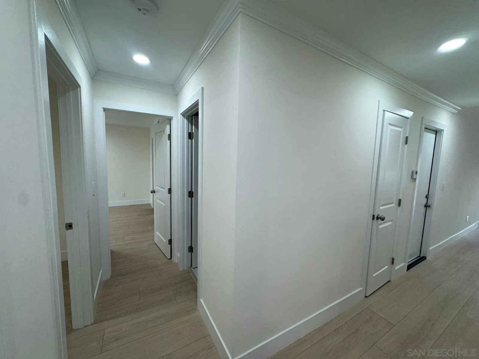 1205 27th Street San Diego, CA 92154 - Photo 8 of 25 wooden view of a hallway with an empty room