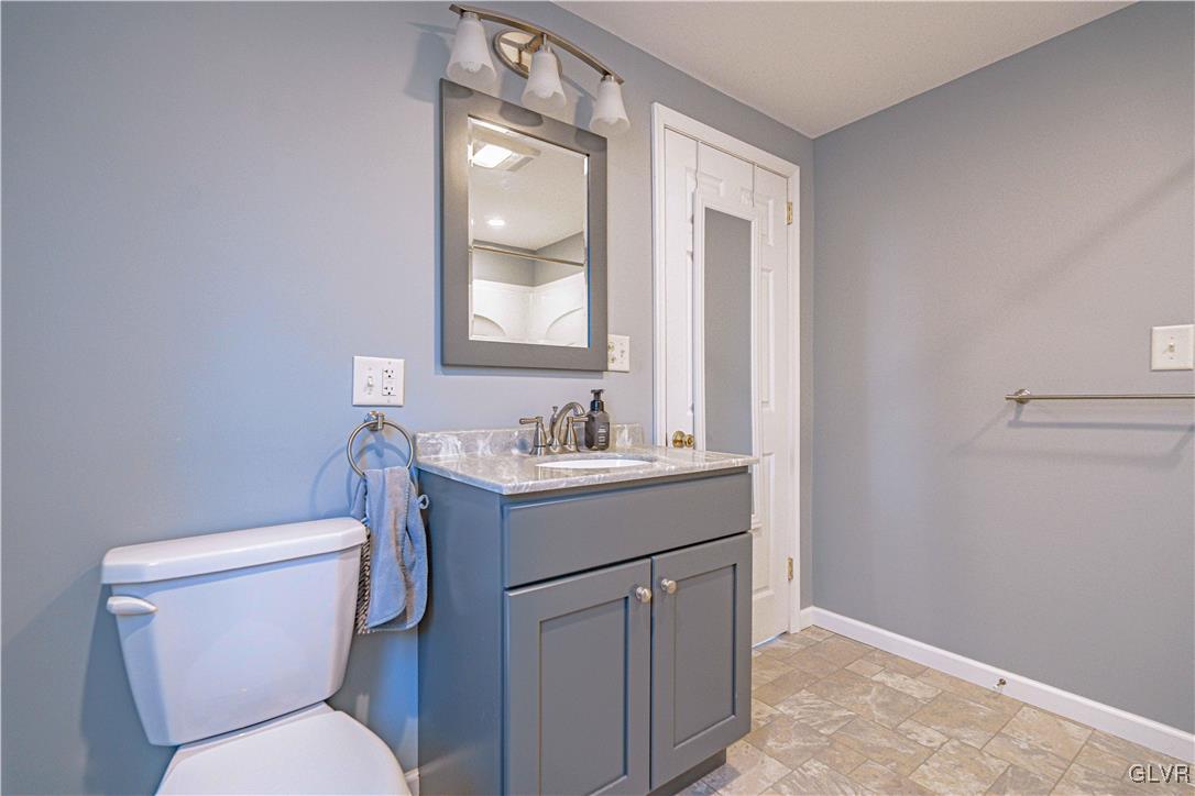 111 Maple Street Coplay, PA 18037 - Photo 15 of 38 a bathroom with a toilet sink and mirror