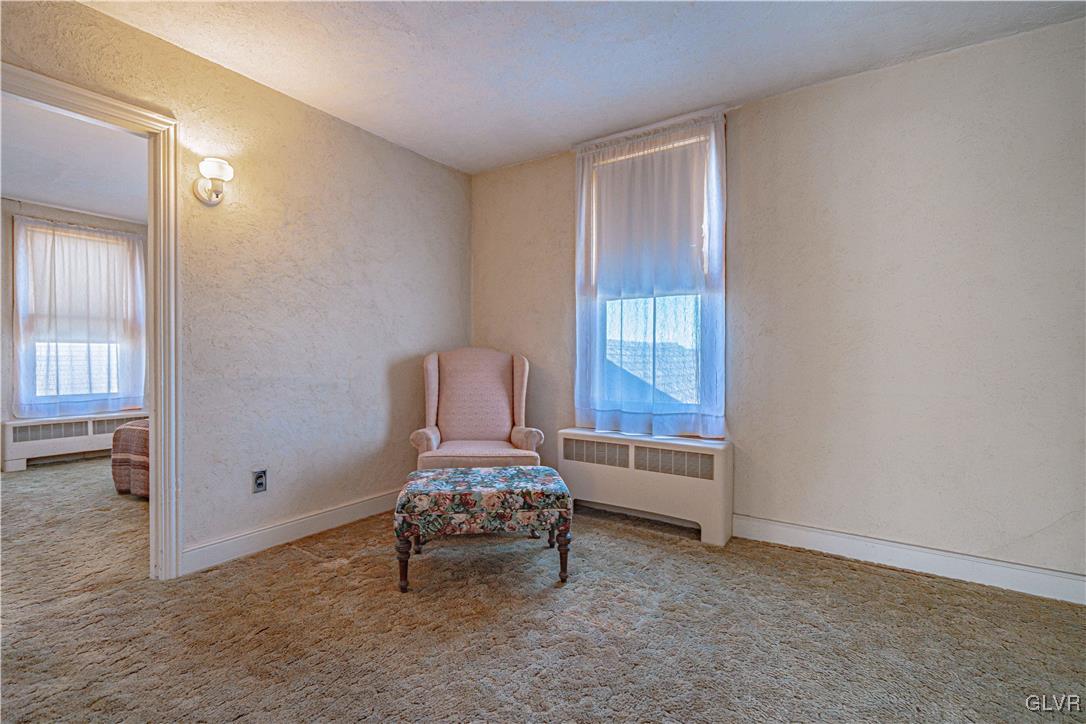 111 Maple Street Coplay, PA 18037 - Photo 18 of 38 a room with a chair and a window