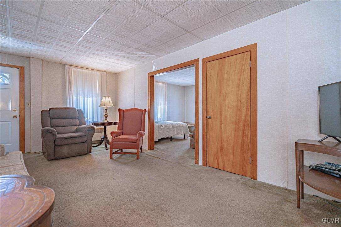 111 Maple Street Coplay, PA 18037 - Photo 6 of 38 a living room with furniture and a flat screen tv