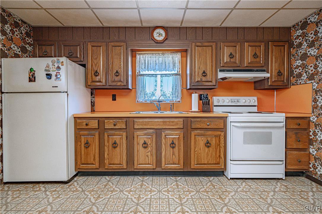 111 Maple Street Coplay, PA 18037 - Photo 10 of 38 a kitchen with cabinets appliances and a counter top