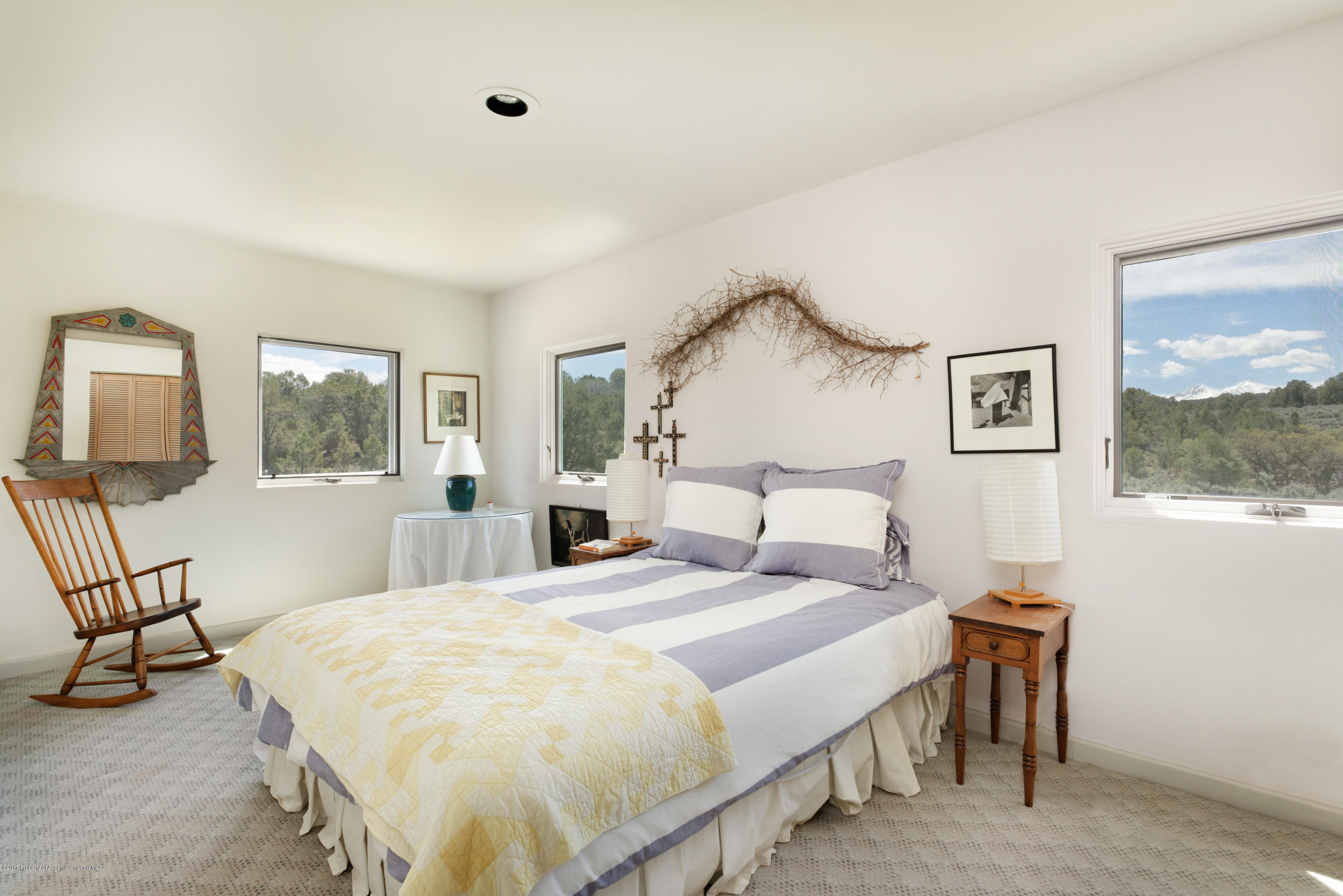 525 Cactus Flats Road Carbondale, CO 81623 - Photo 14 of 49 a spacious bedroom with a bed and window
