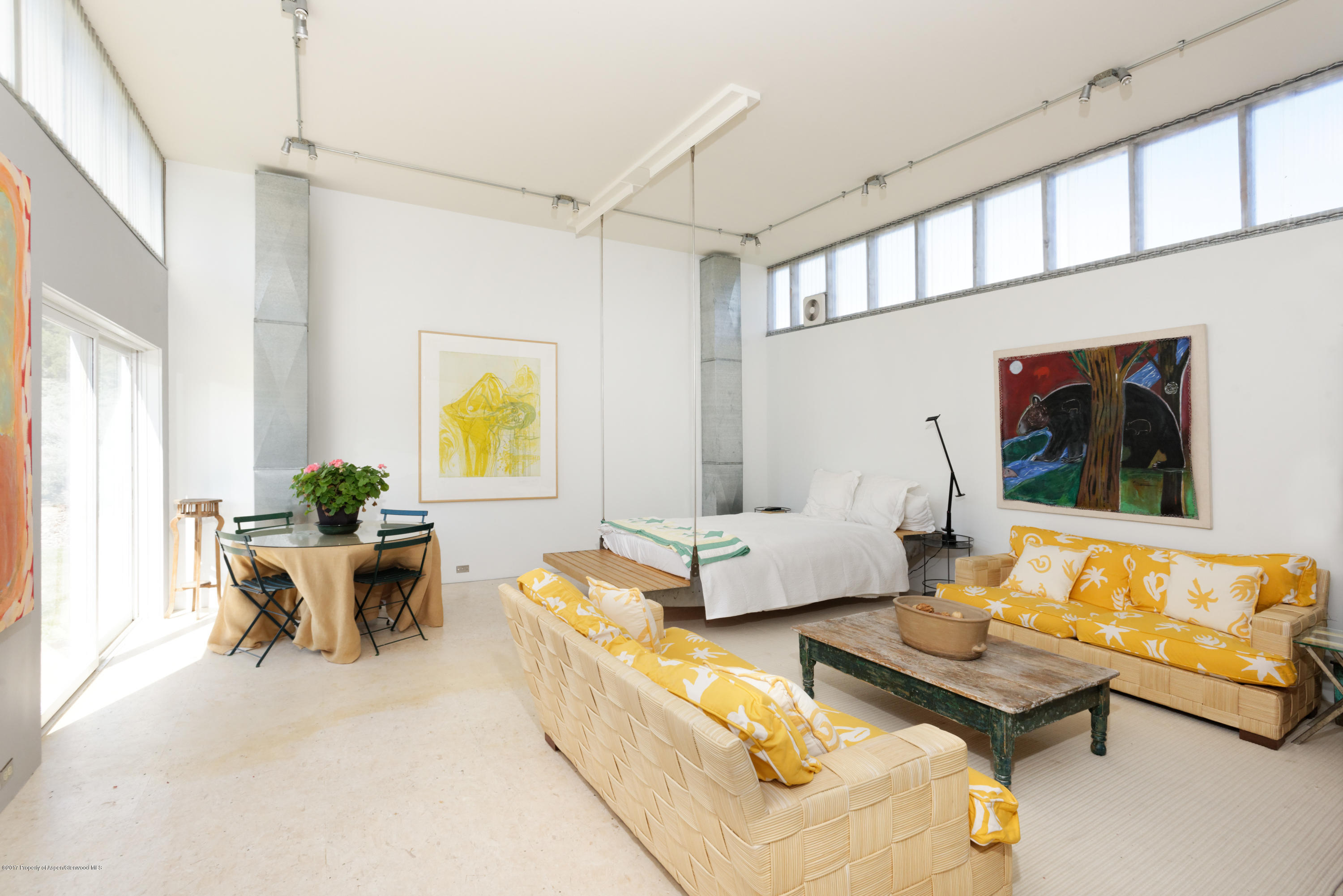 525 Cactus Flats Road Carbondale, CO 81623 - Photo 19 of 49 a living room with furniture and a flat screen tv