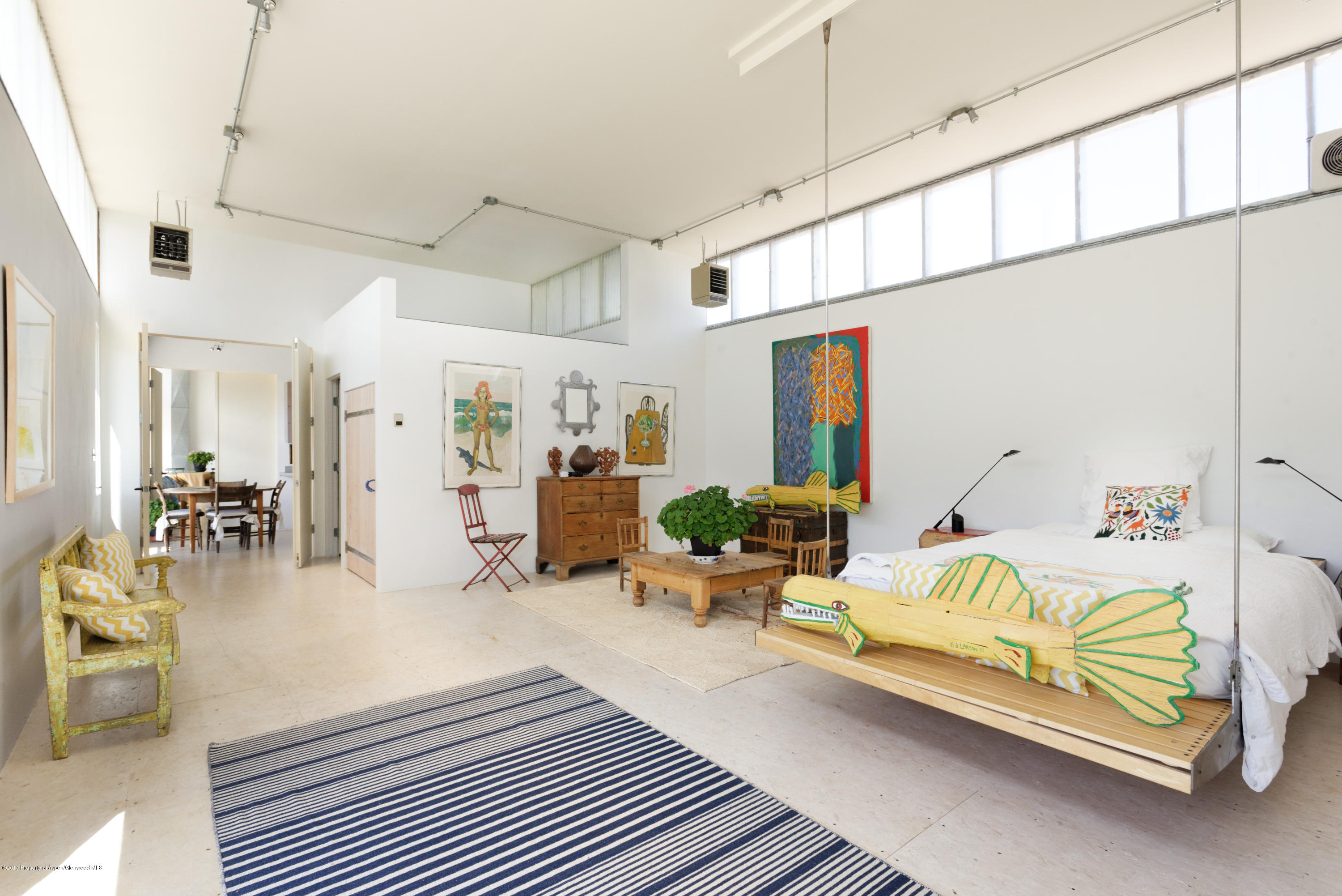 525 Cactus Flats Road Carbondale, CO 81623 - Photo 22 of 49 a bedroom with furniture and a large window