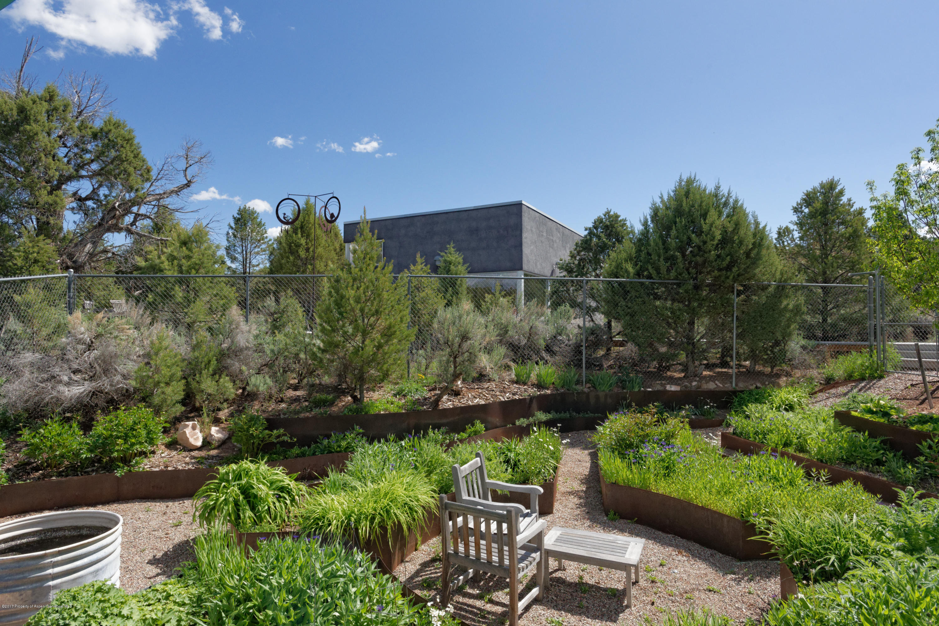 525 Cactus Flats Road Carbondale, CO 81623 - Photo 31 of 49 a view of a chair and table in the garden