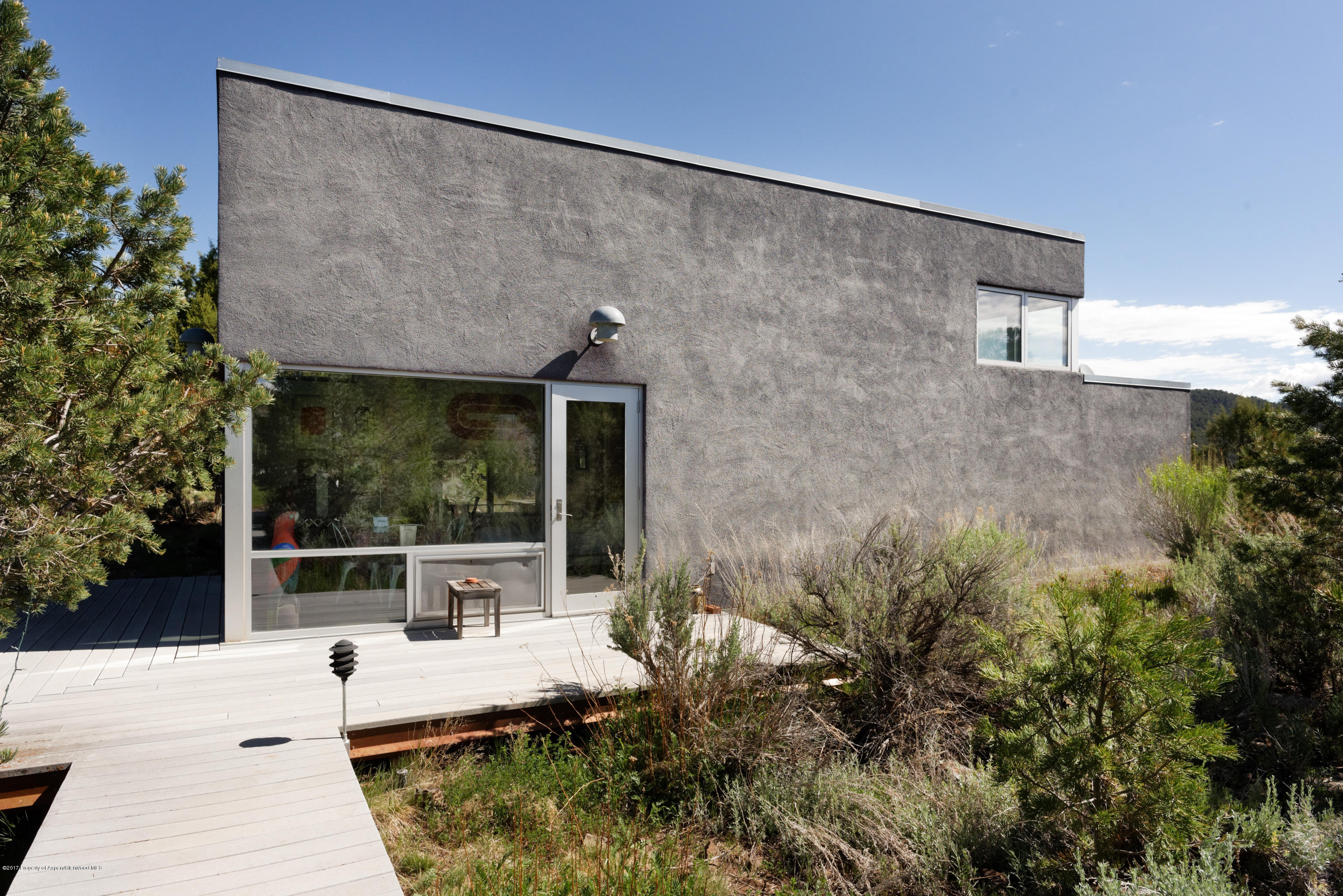 525 Cactus Flats Road Carbondale, CO 81623 - Photo 32 of 49 a view of house with backyard and sitting area