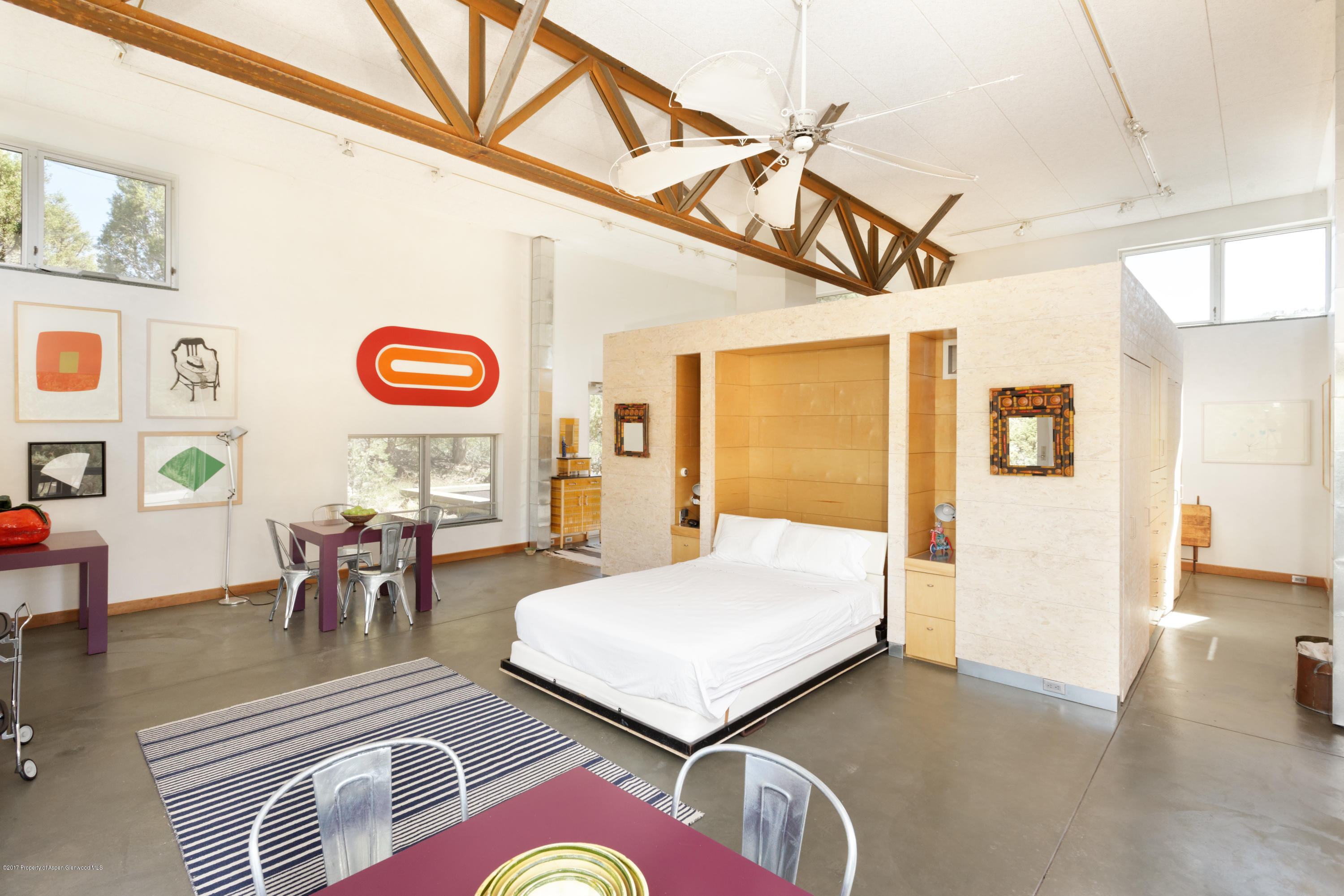 525 Cactus Flats Road Carbondale, CO 81623 - Photo 33 of 49 a bedroom with furniture and a wooden floor