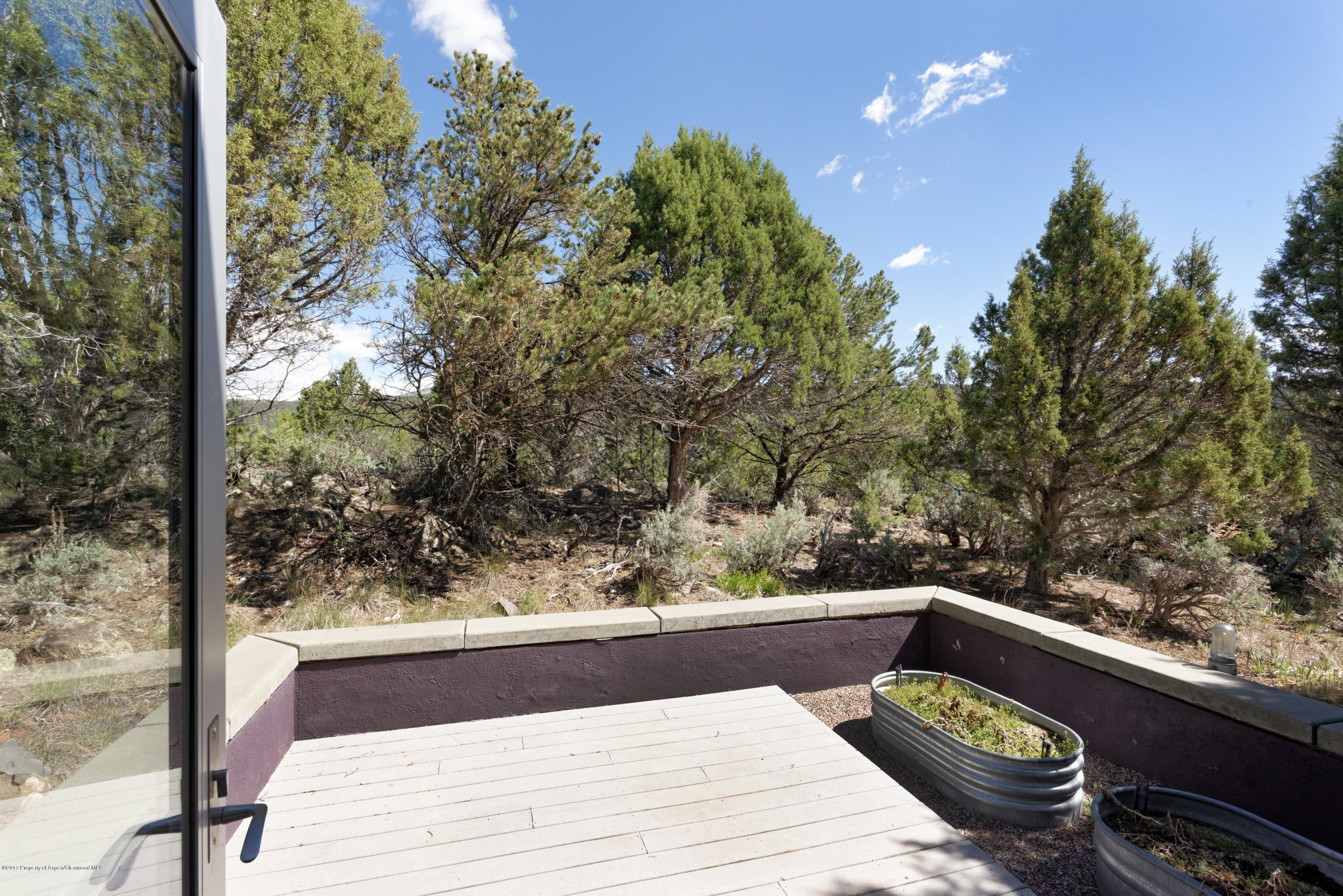 525 Cactus Flats Road Carbondale, CO 81623 - Photo 39 of 49 a wooden bench sitting in front of a building