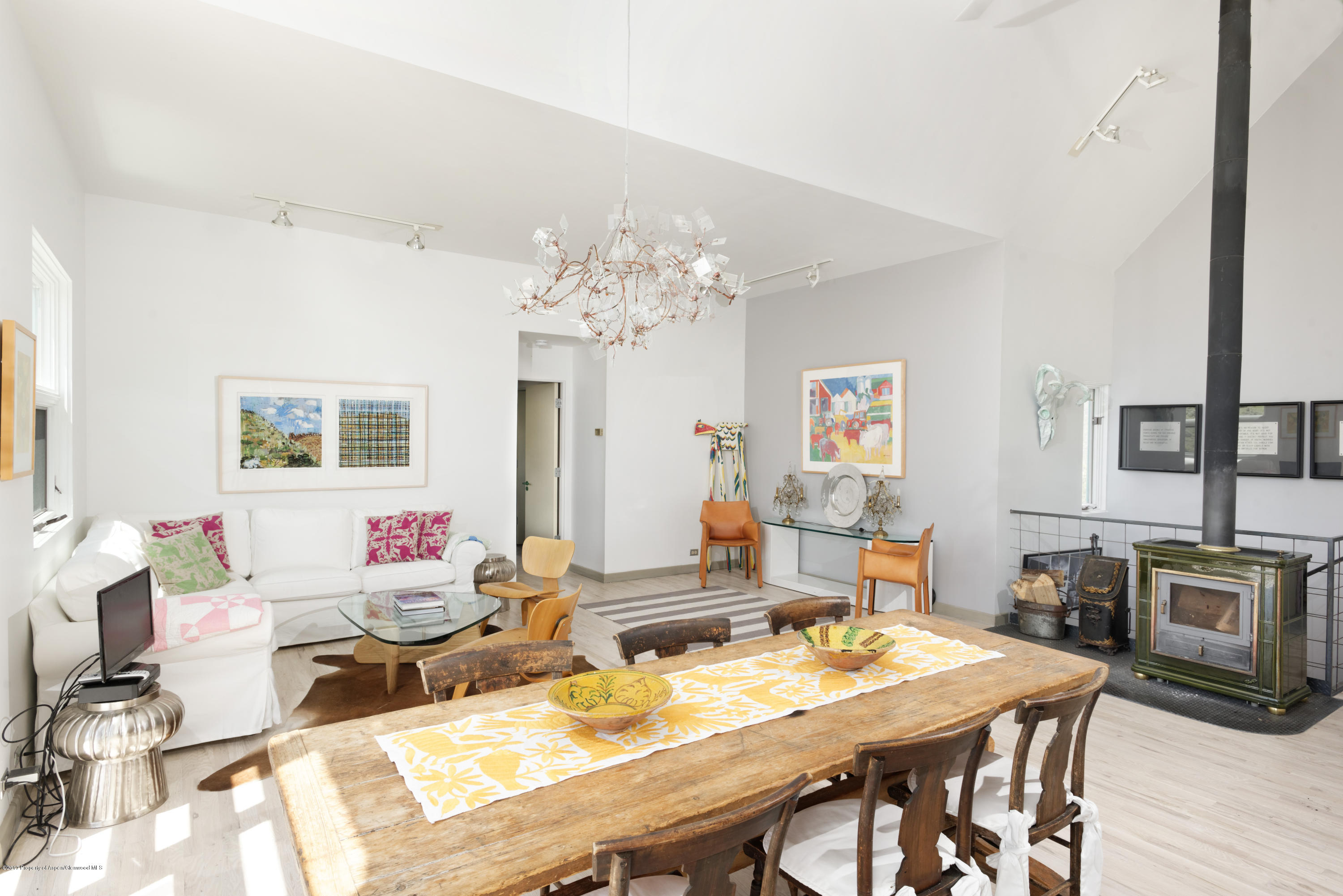525 Cactus Flats Road Carbondale, CO 81623 - Photo 8 of 49 a living room with fireplace furniture and a chandelier