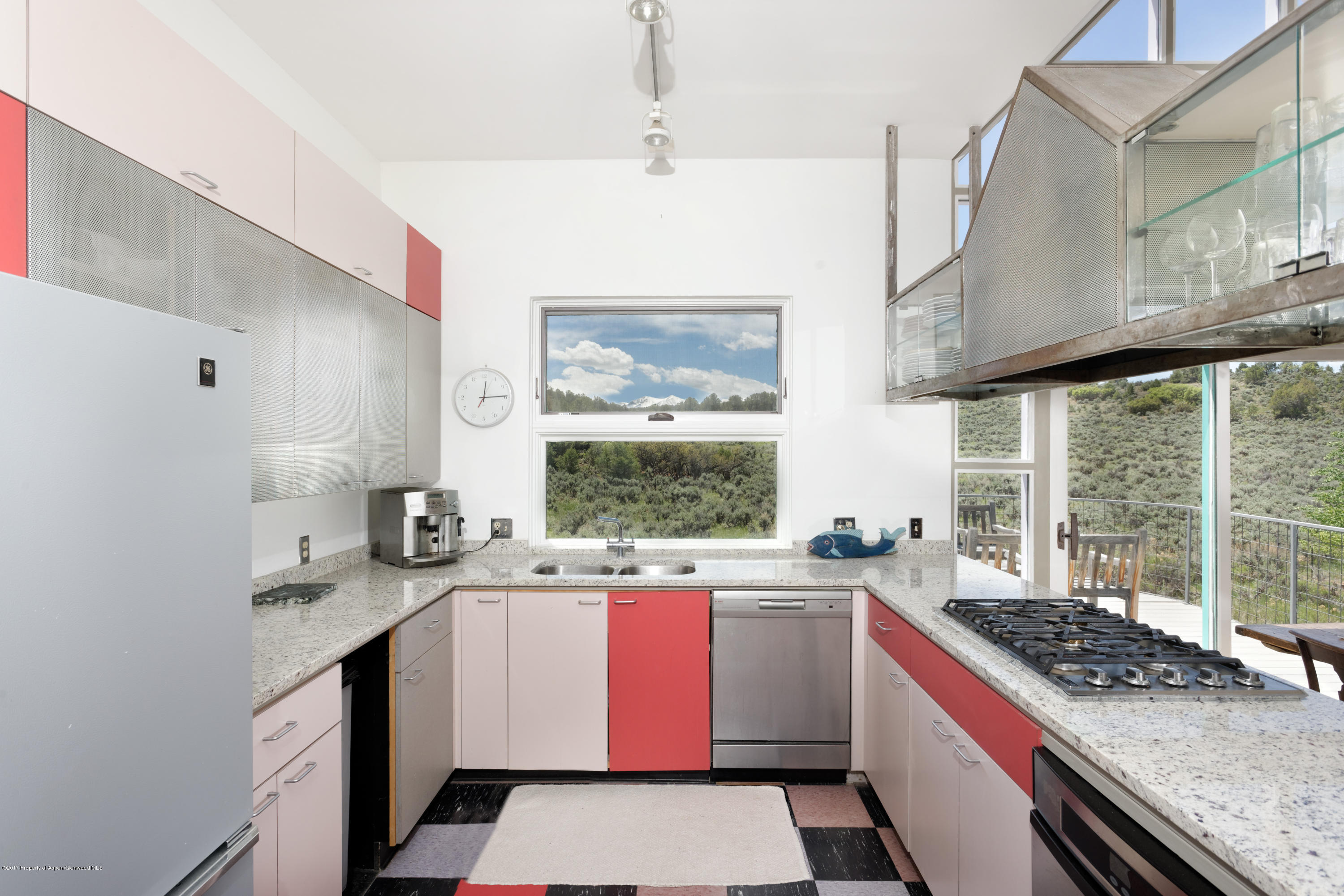 525 Cactus Flats Road Carbondale, CO 81623 - Photo 9 of 49 a kitchen with a sink stove and cabinets