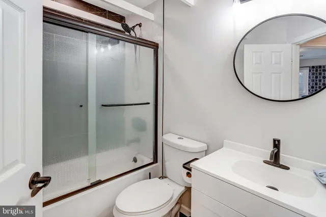 a view of room with window and a flat screen tv