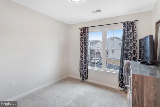 a view of livingroom with furniture and window