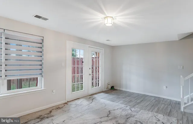 a view of an empty room and closet area