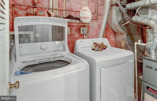 a view of a backyard with wooden fence and floor