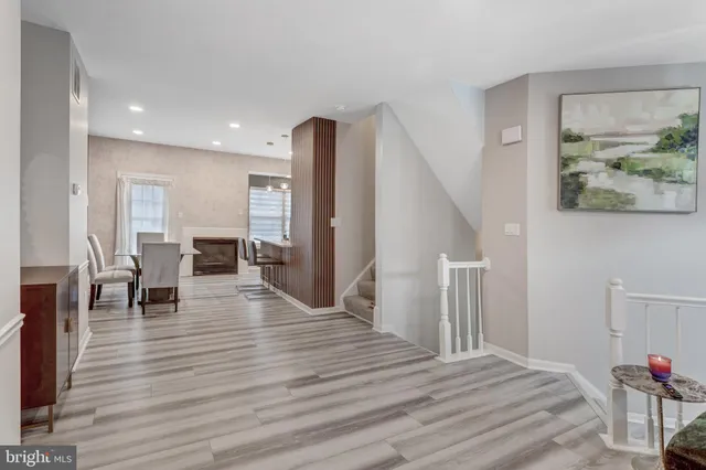 a view of a livingroom with furniture and wooden floor