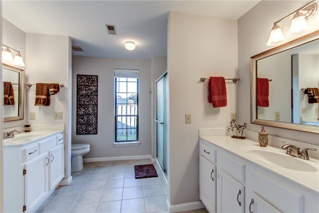 1353 Gen George Patton Road, Unit 1353 Nashville, TN 37221 - Photo 14 of 20 The master bath has separate vanities, a walk-in closet, separate shower and tub.