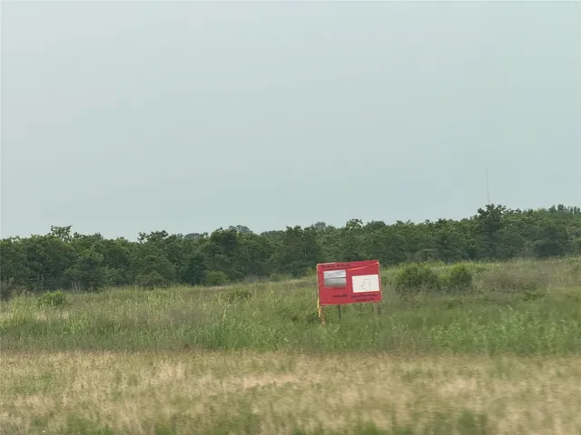 a view of lake with green space