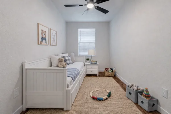 a bed room with a bed and a window