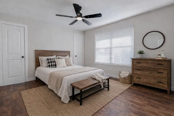 a bedroom with a bed and a dresser