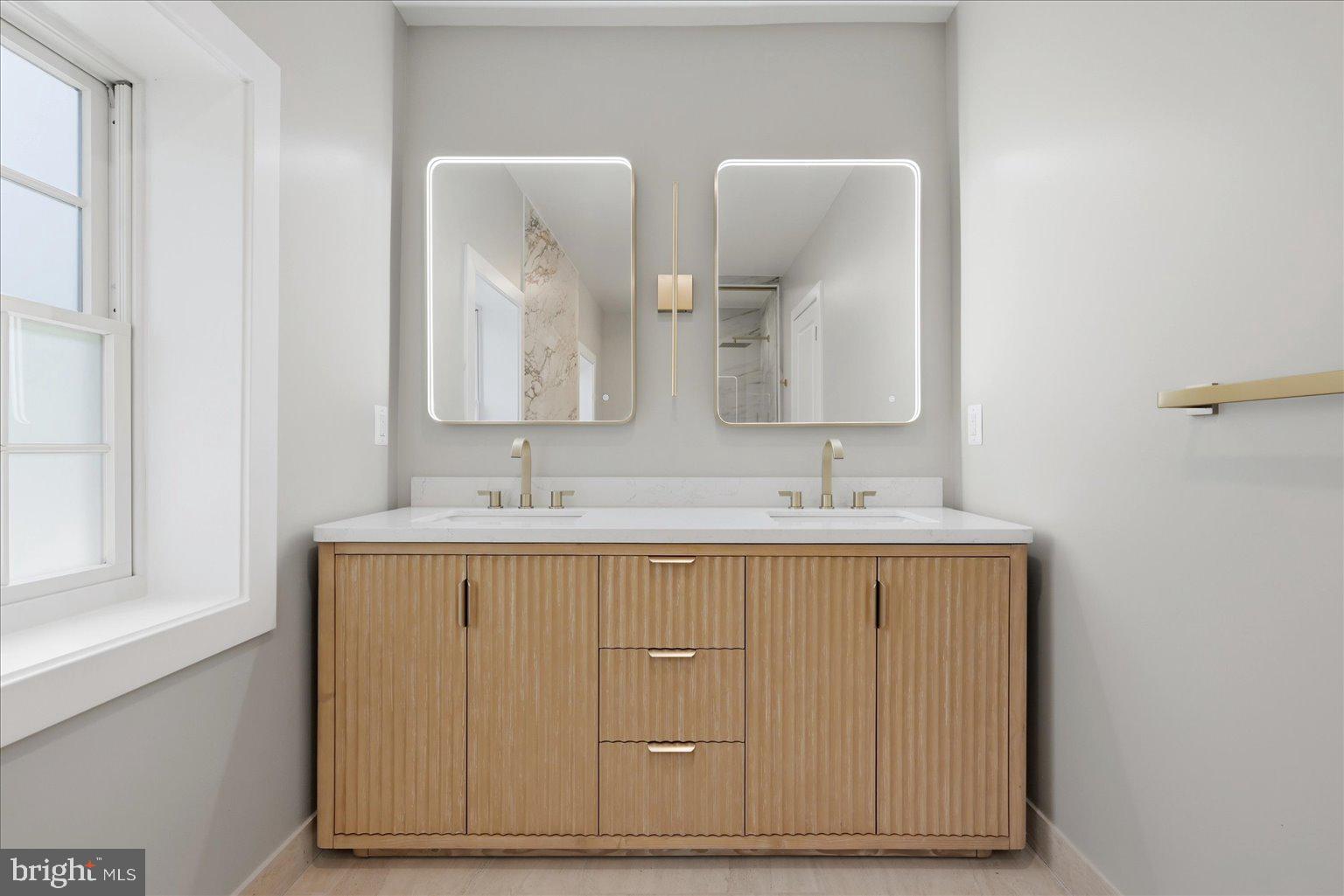 3517 Rodman Street Northwest Washington, DC 20008 - Photo 24 of 57 a bathroom with a sink and a mirror