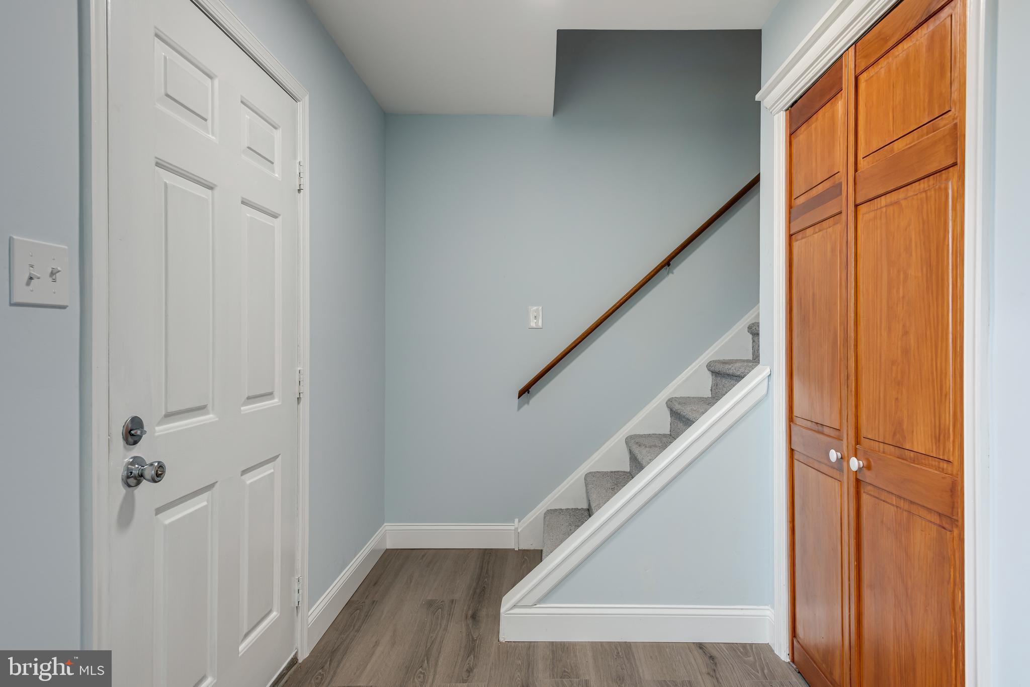 19 Windemere Court Downingtown, PA 19335 - Photo 11 of 24 a view of entryway with wooden floor and stairs