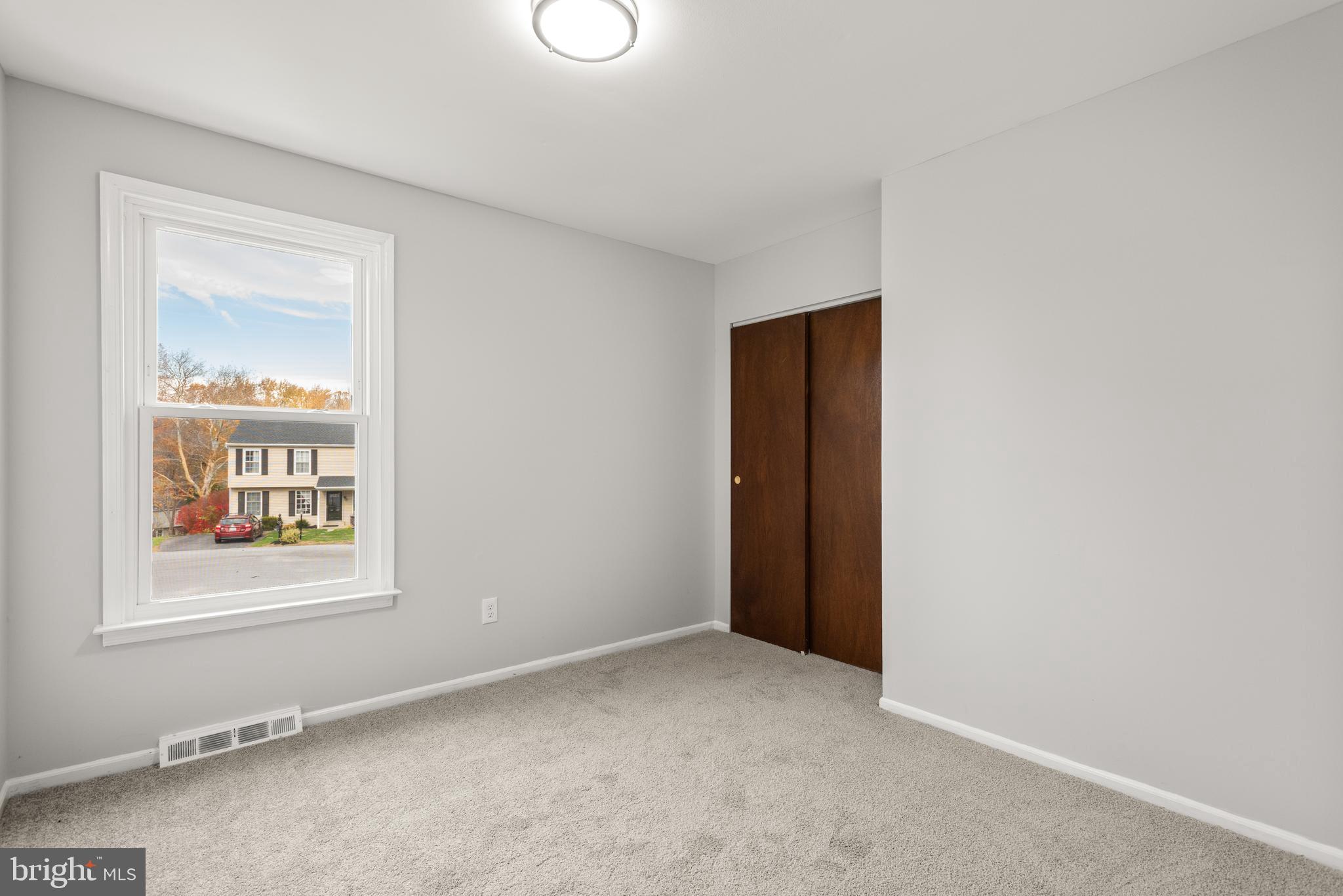 19 Windemere Court Downingtown, PA 19335 - Photo 17 of 24 an empty room with windows and closet